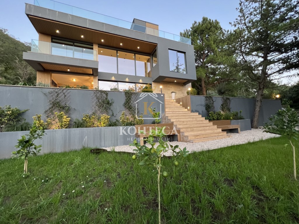 A contemporary family villa with a swimming pool and a panoramic view of the Tivat Bay